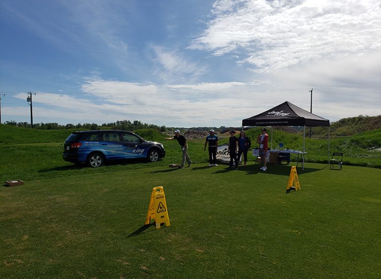 Golfers playing washer toss